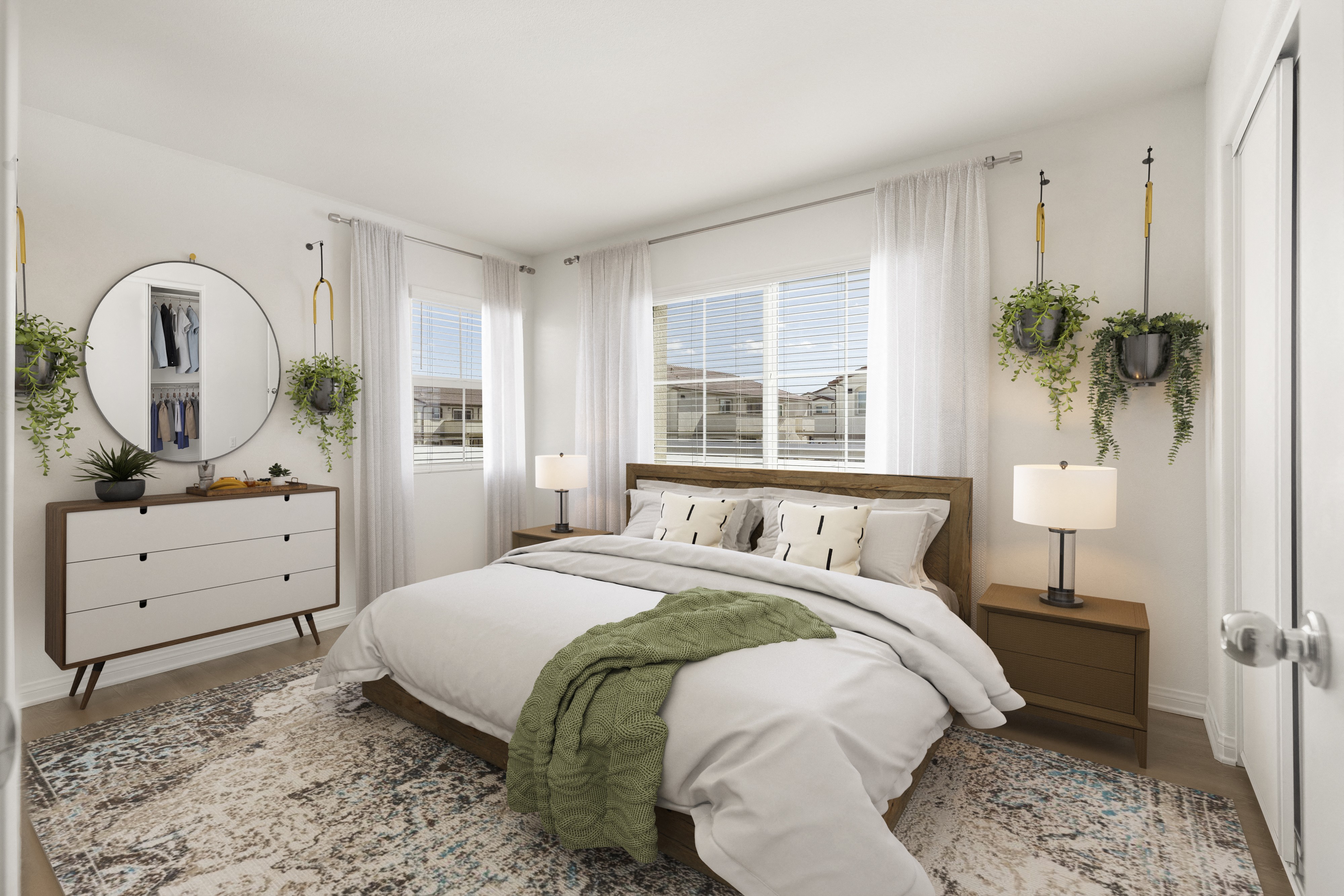 a bedroom with a bed and two windows